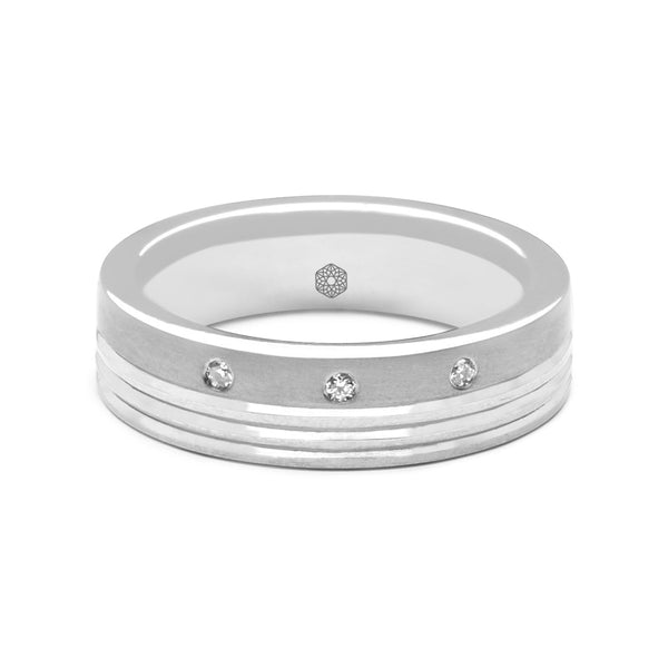 Horizontal shot of Mens Wedding Ring With a Matte Finish , Groove Pattern and Three Offset Round Brilliant Cut Diamonds