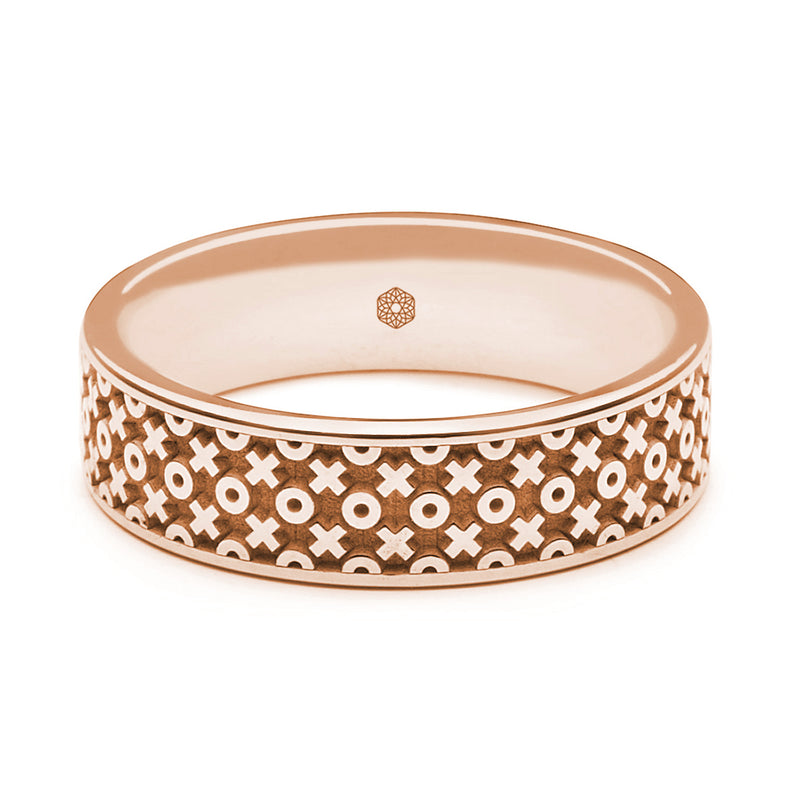 Horizontal Shot of Mens 9ct Rose Gold Flat Court Shape Wedding Ring With X's and O's Pattern