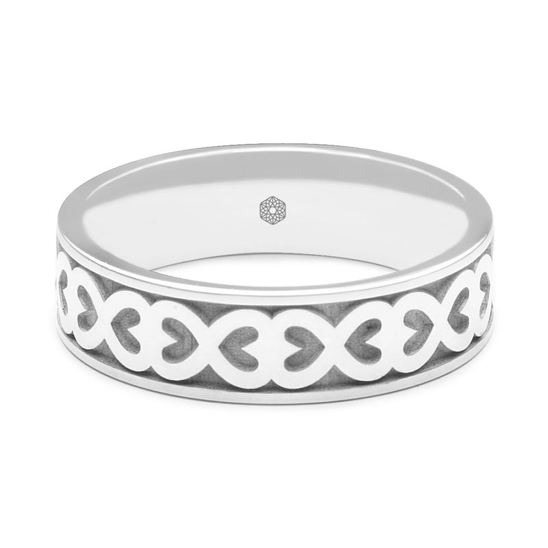 Horizontal Shot of Mens 9ct White Gold Flat Court Wedding Ring With Hearts Pattern
