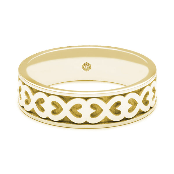 Horizontal Shot of Mens 9ct Yellow Gold Flat Court Wedding Ring With Hearts Pattern