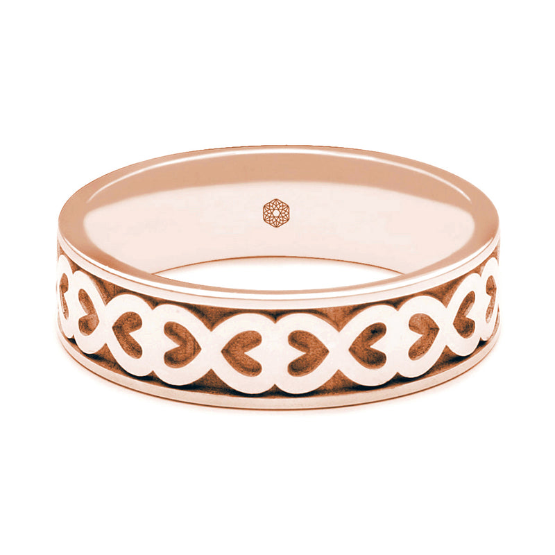 Horizontal Shot of Mens 18ct Rose Gold Flat Court Wedding Ring With Hearts Pattern