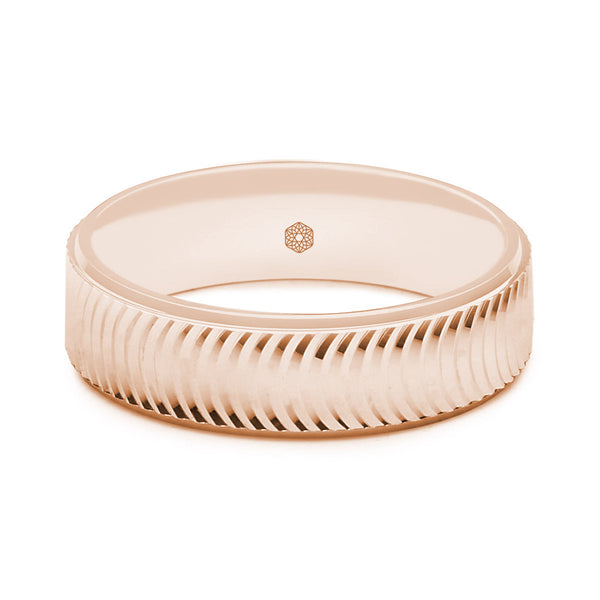 Horizontal Shot of Mens Matte Finish 9ct Rose Gold Flat Court Shape Wedding Ring With Semi-Circular Pattern and Polished Edges