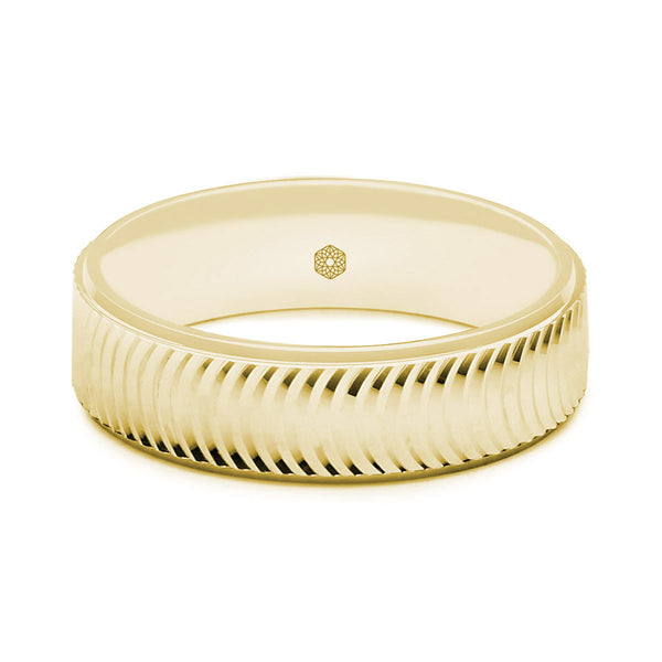 Horizontal Shot of Mens Matte Finish 9ct Yellow Gold Flat Court Shape Wedding Ring With Semi-Circular Pattern and Polished Edges